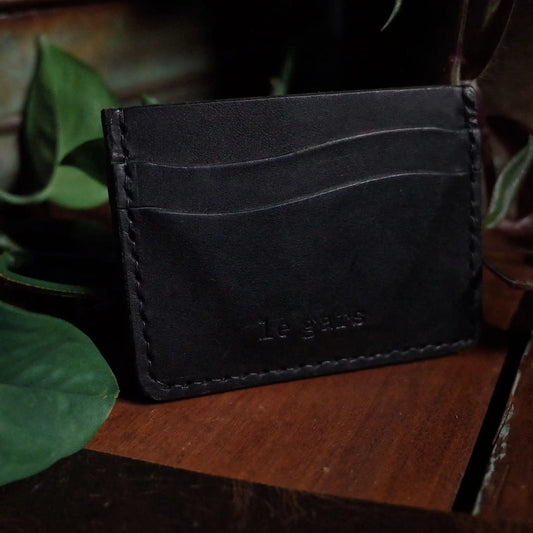 Full-grain leather wallet in black with minimalist design