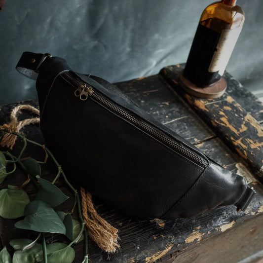 Large black leather belt bag designed for ample storage