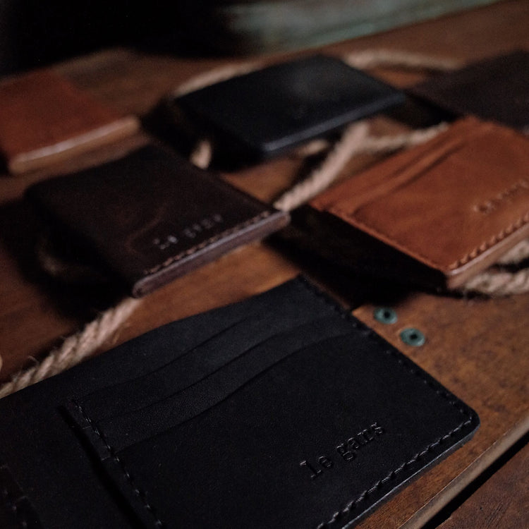 Handcrafted full-grain leather wallet with unique patina, designed and made in Montreal.