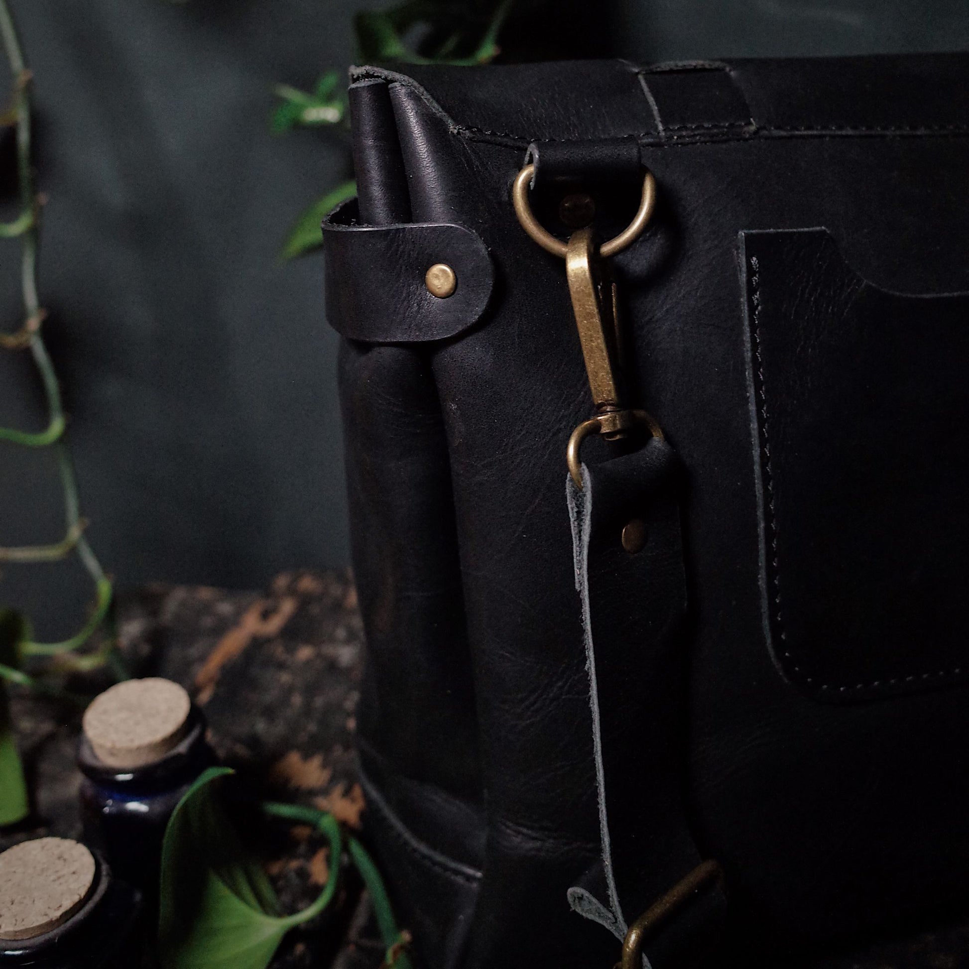 Sleek black leather shoulder bag perfect for work and travel
