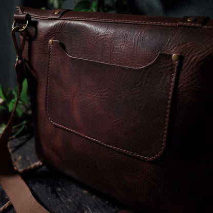 Sleek chestnut brown leather shoulder bag perfect for work and travel
