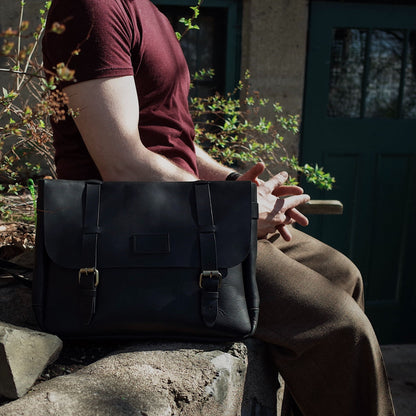 Sleek black Champlain leather tote with classic design
