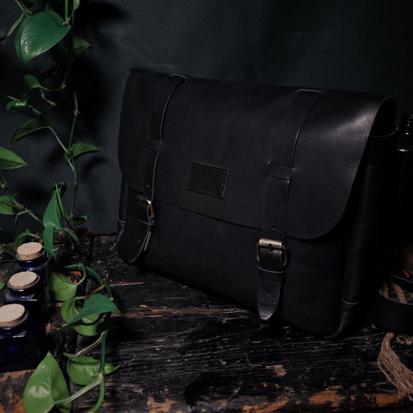 Rustic black leather carryall handcrafted by artisans
