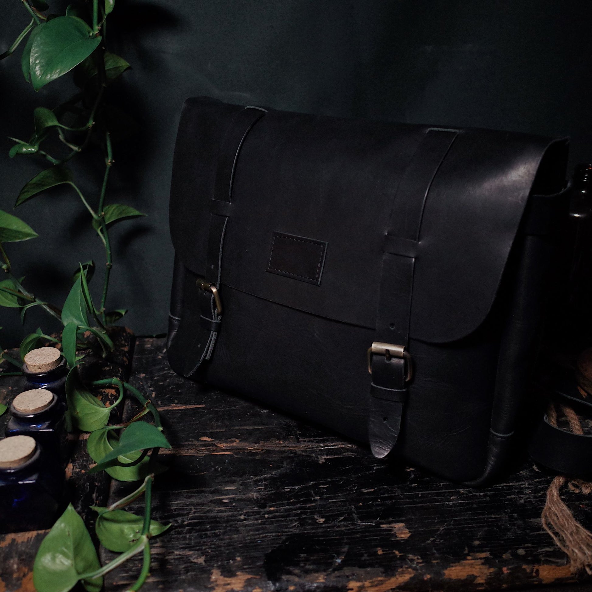 Rustic black leather carryall handcrafted by artisans
