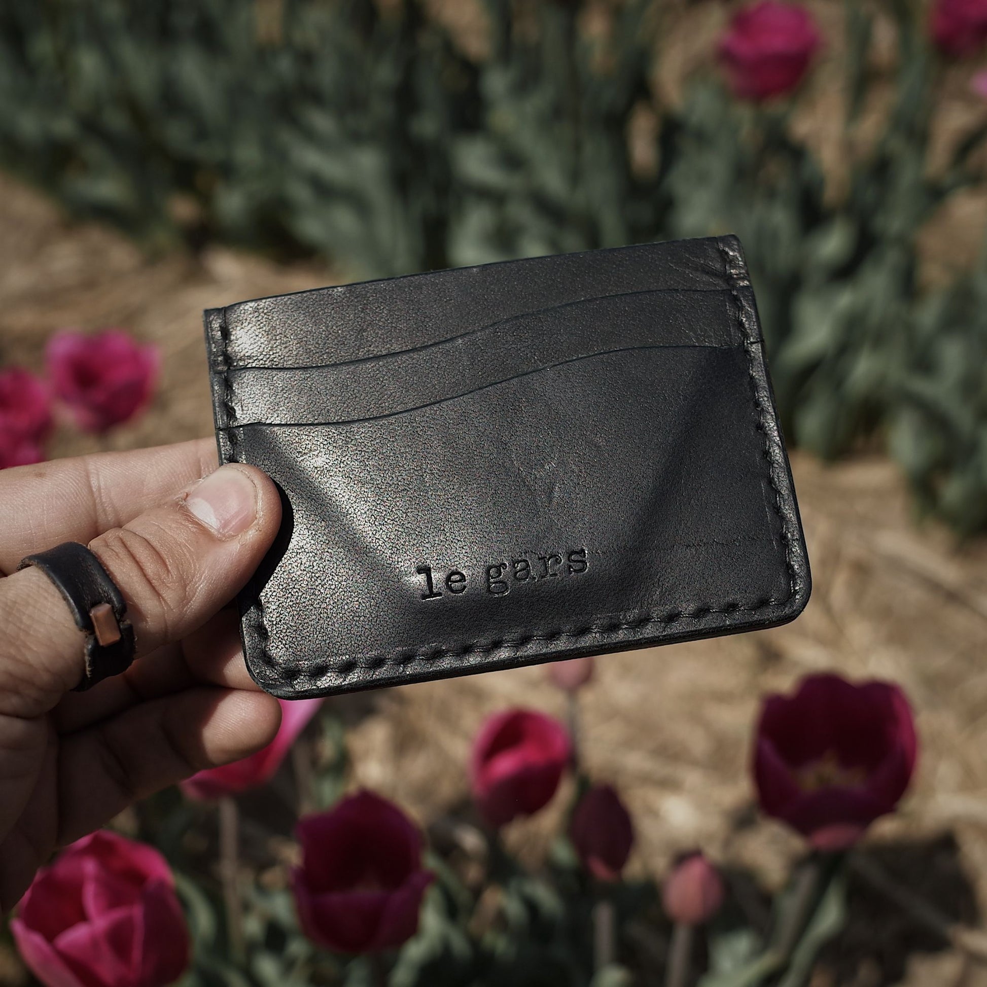 Elegant black leather wallet handcrafted by Montreal artisans