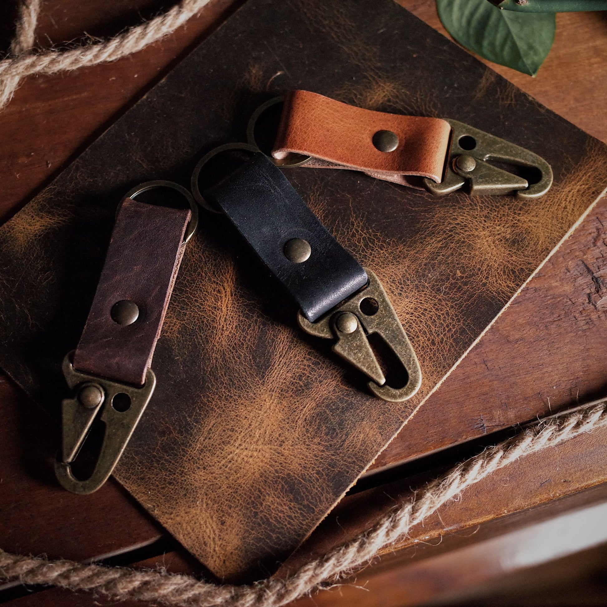 Locally crafted honey brown leather keyring with rugged military-style carabiner
