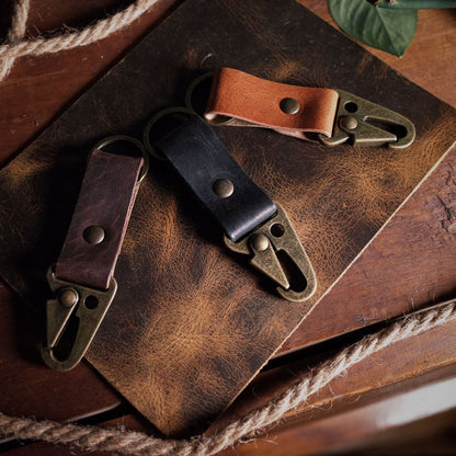 Locally crafted honey brown leather keyring with rugged military-style carabiner
