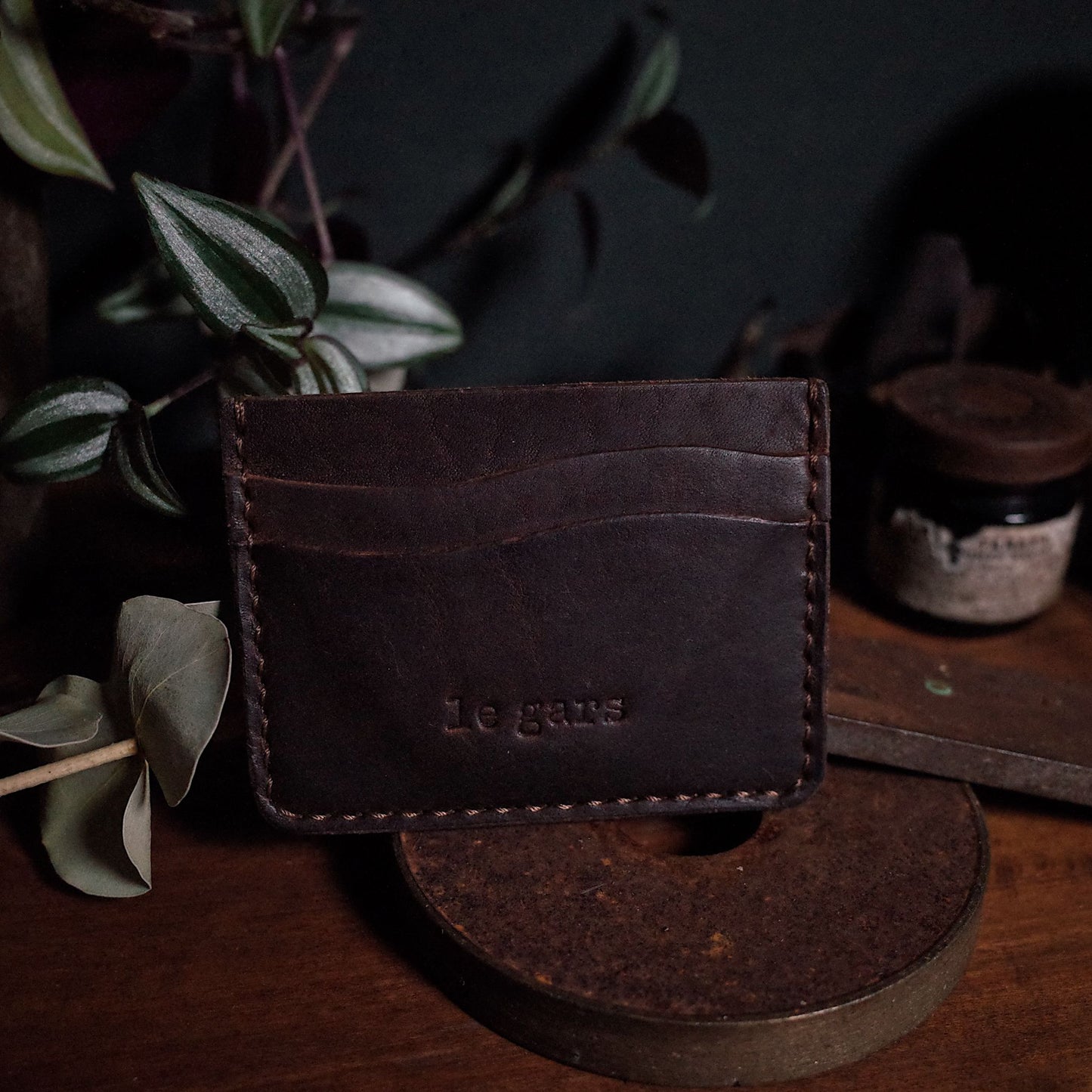 Rustic dark-brown leather wallet handcrafted by artisans
