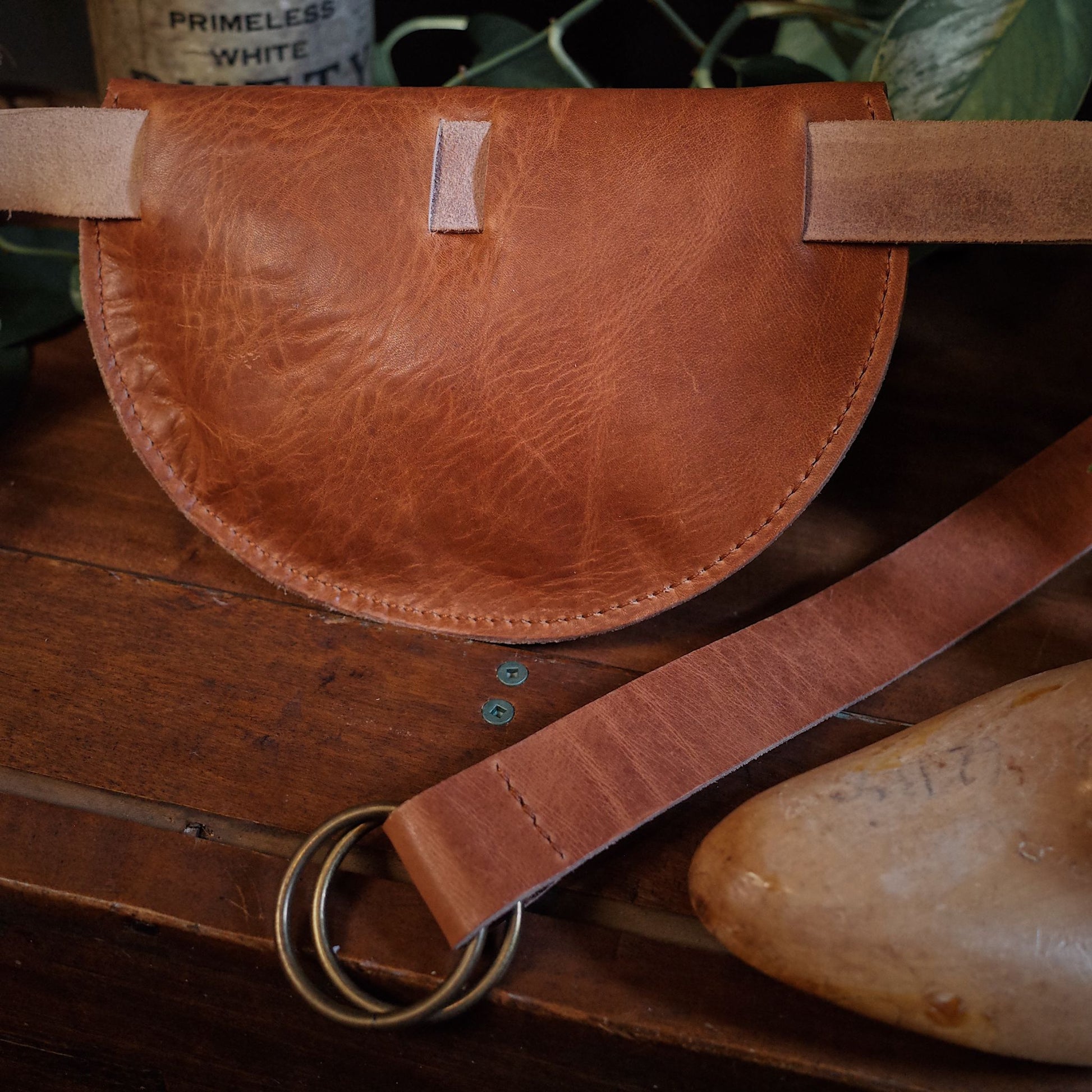 Artisanal caramel leather belt bag ideal for night-outs and events

