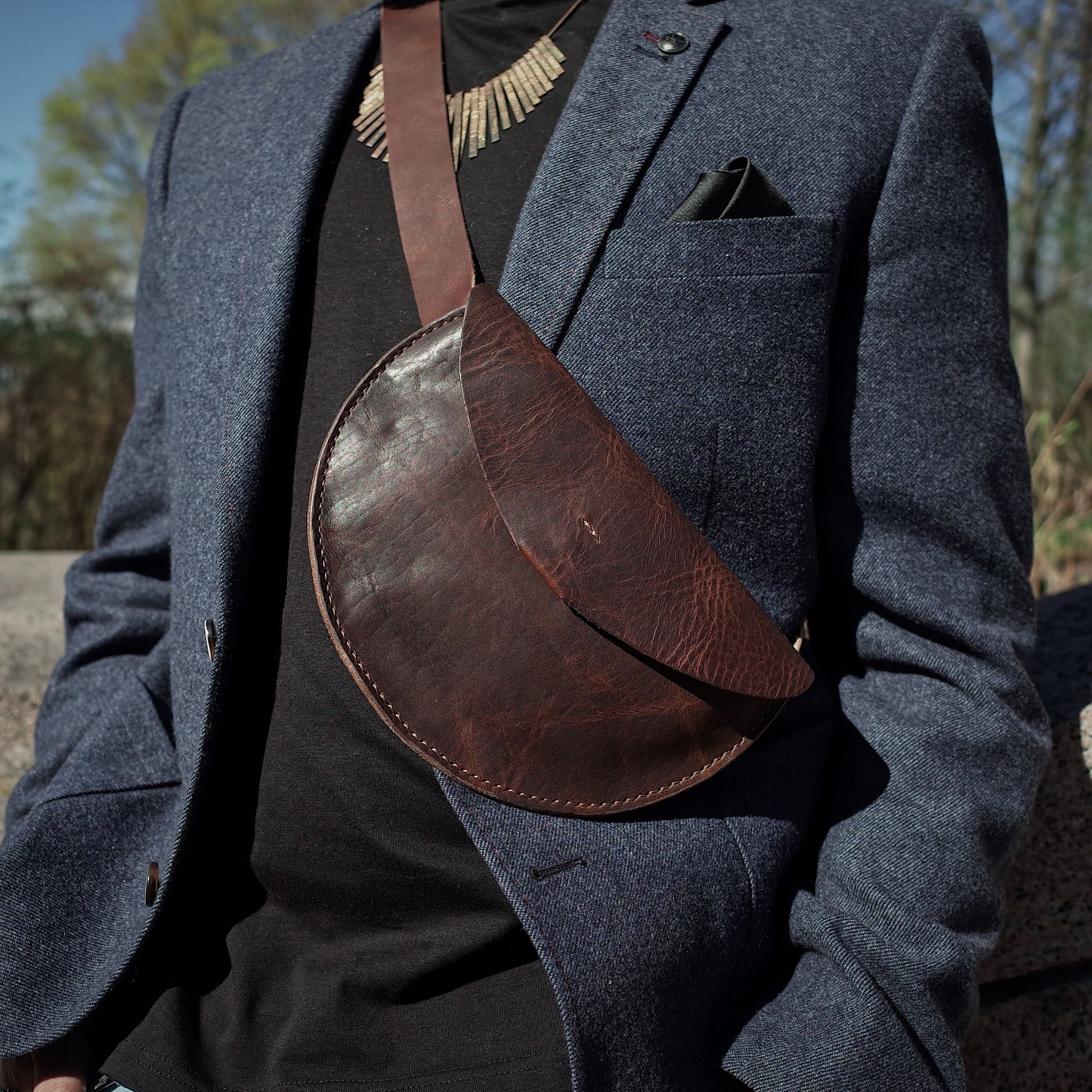 Durable coffee brown leather moon bag with adjustable buckle
