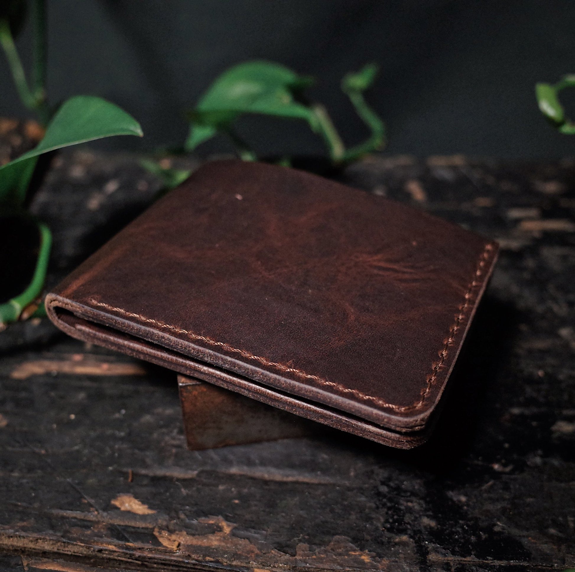 Elegant chestnut leather bifold wallet with functional design
