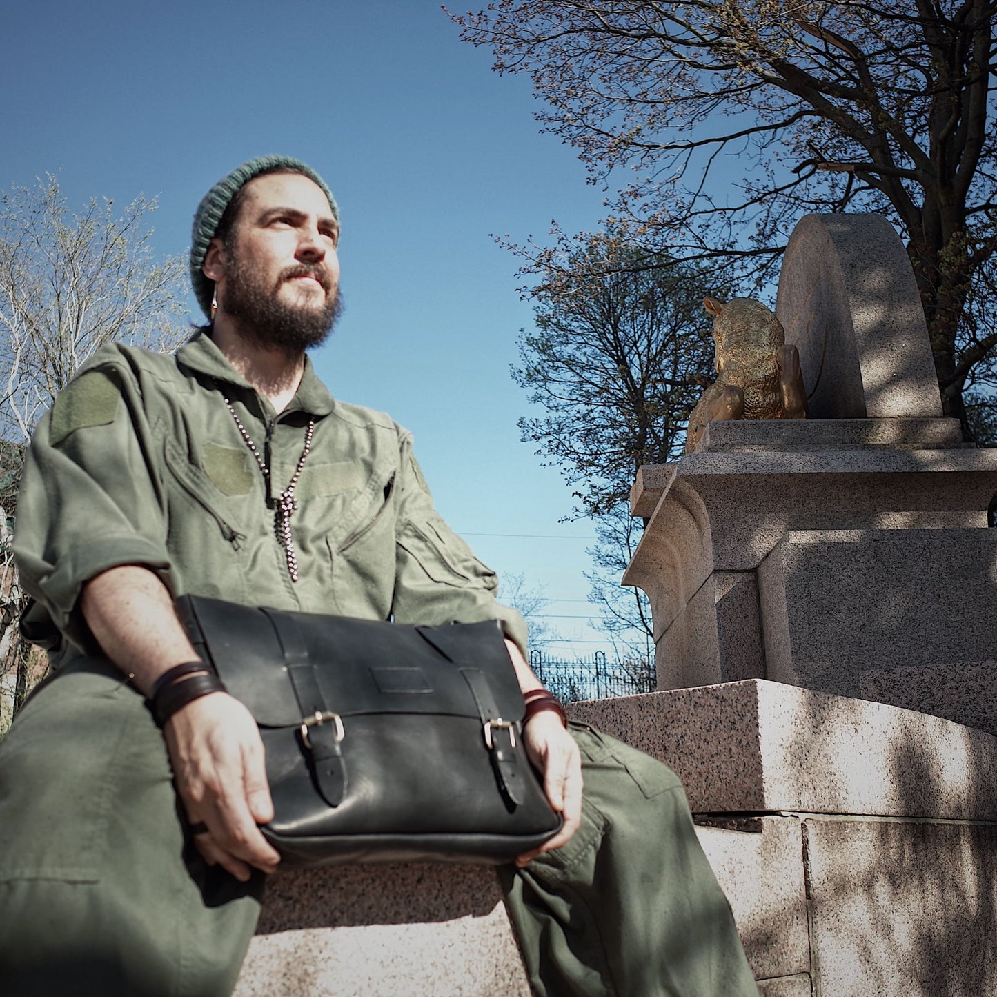 Eco-conscious black leather messenger bag crafted from Horween leather
