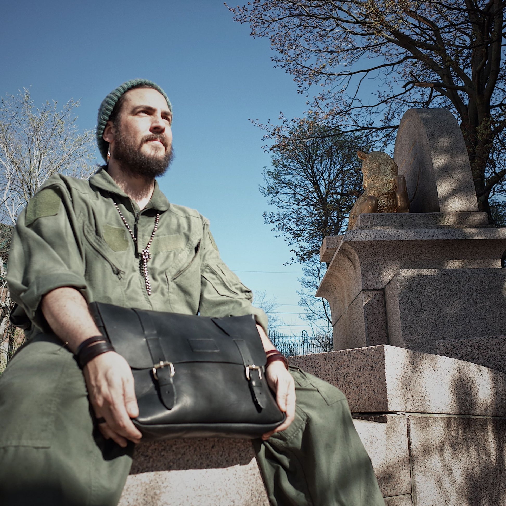 Eco-conscious black leather messenger bag crafted from Horween leather
