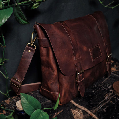 Spacious dark-brown leather messenger bag with adjustable shoulder strap
