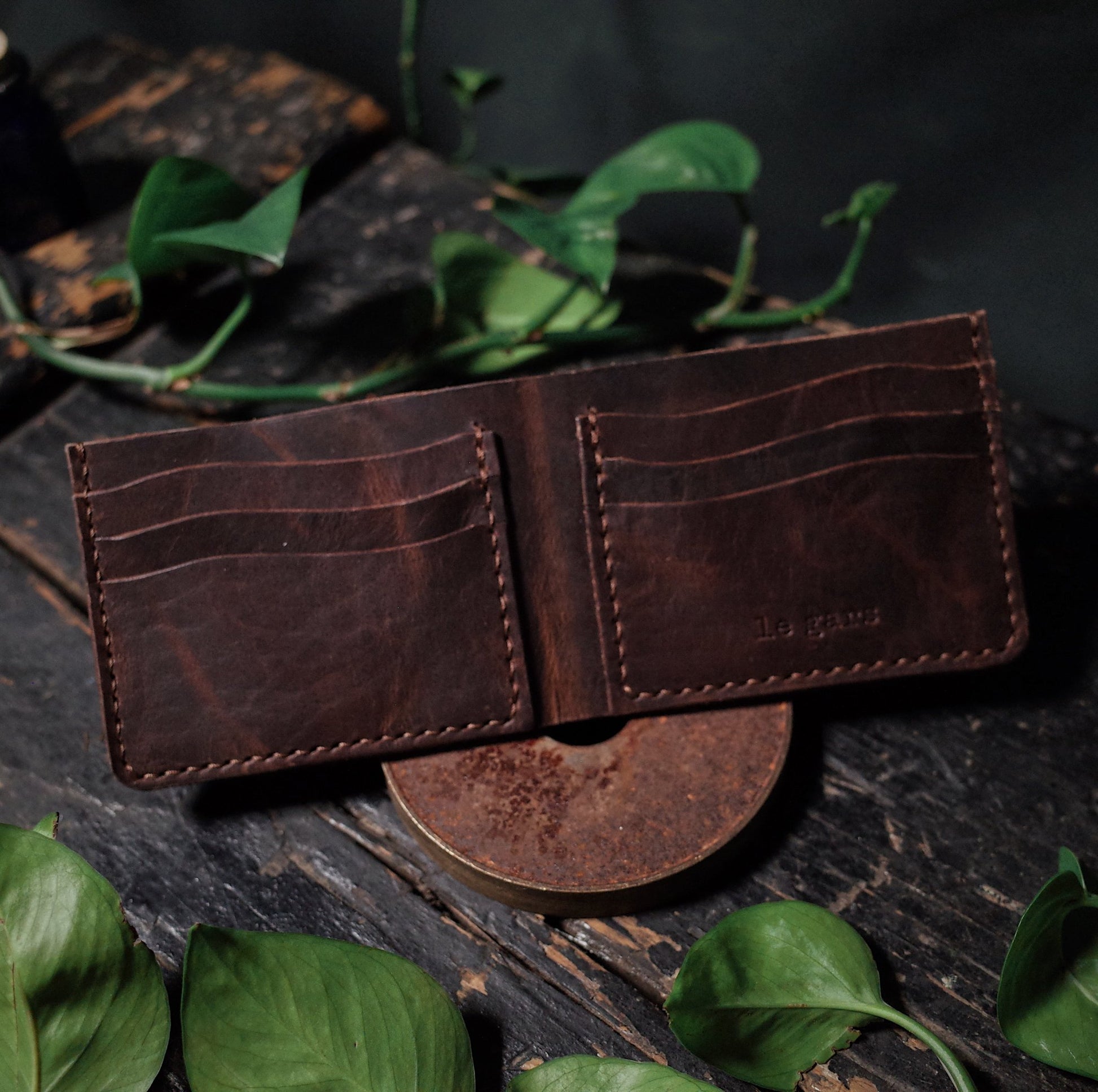High-quality dark-brown leather bifold wallet with RFID protection
