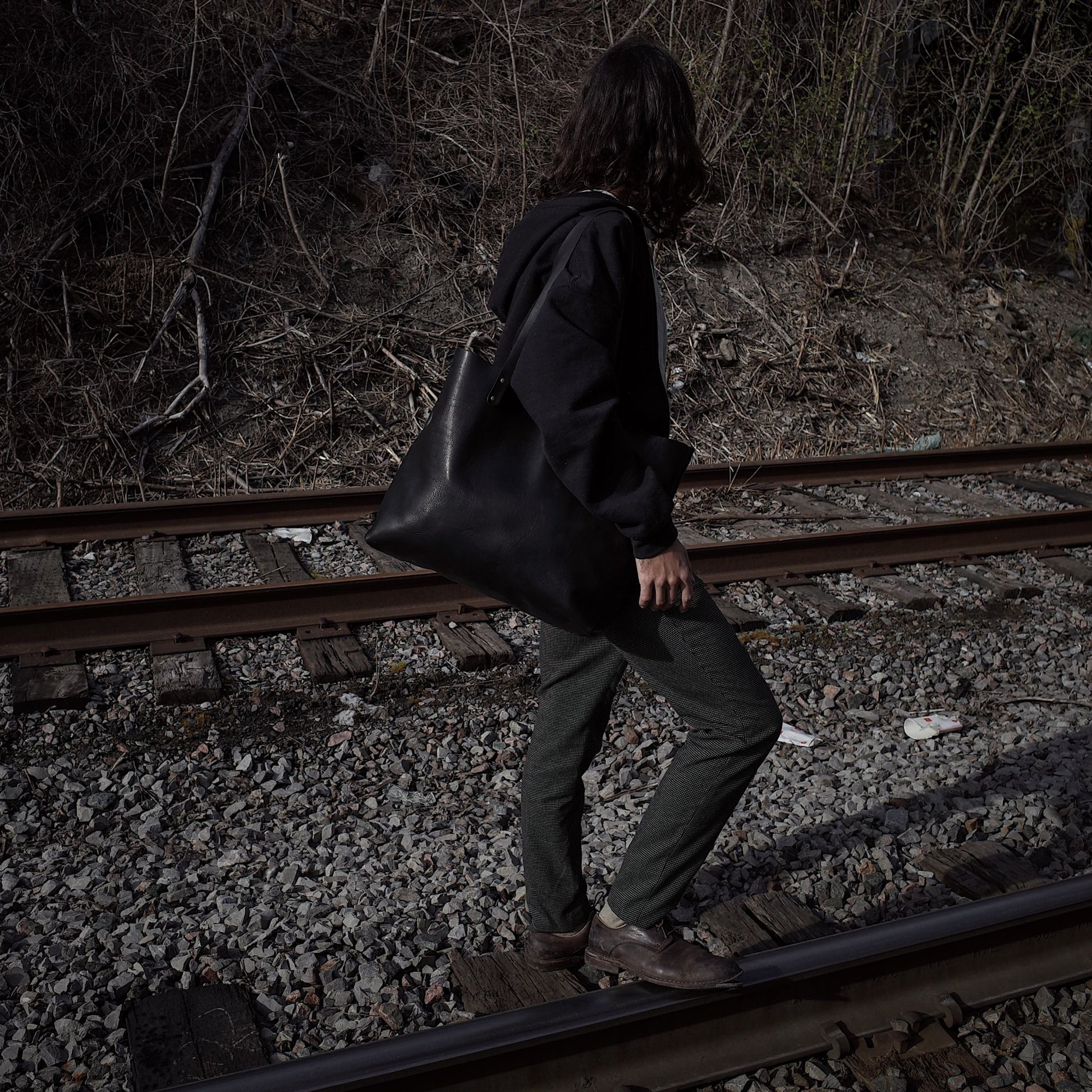 Spacious black leather satchel designed for professionals

