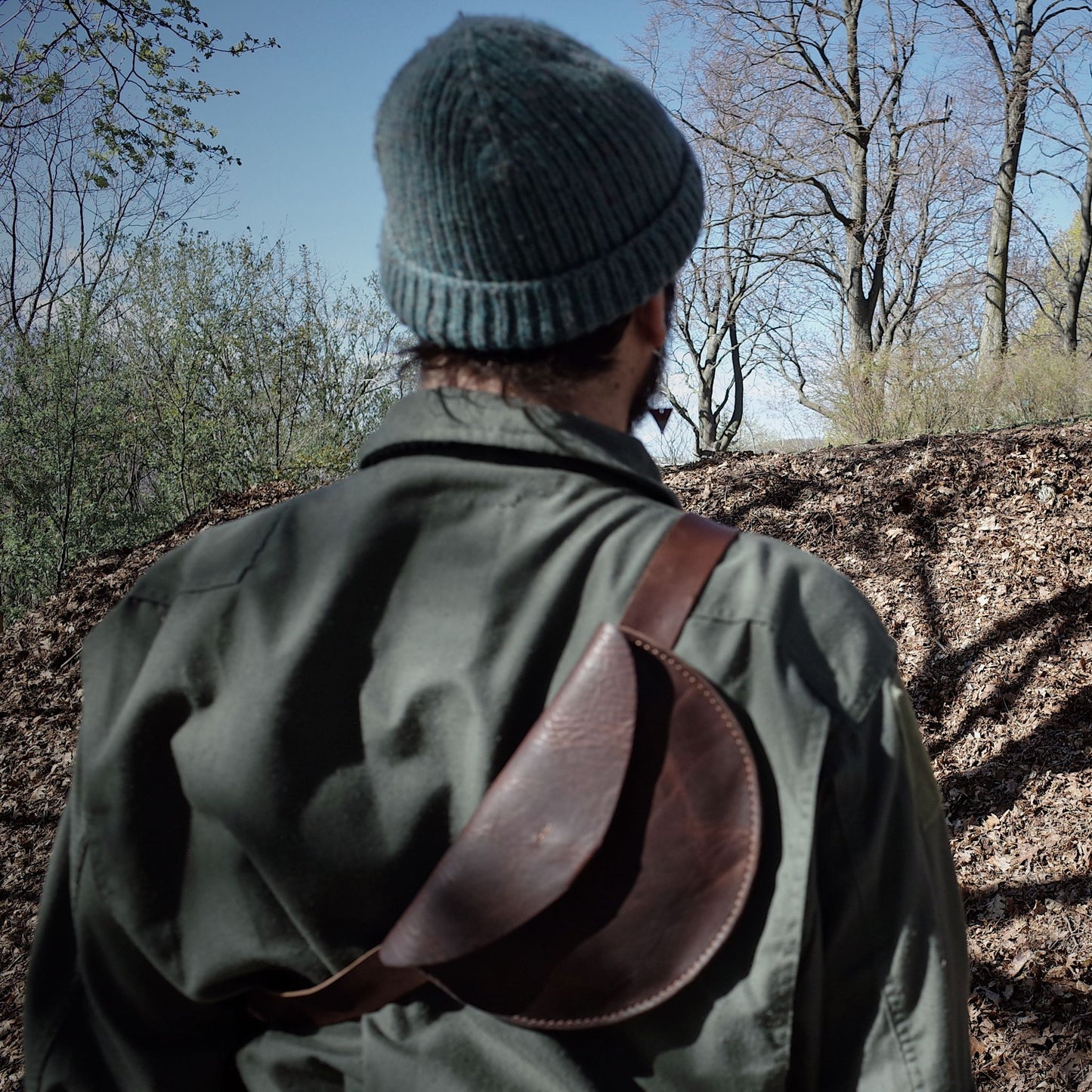 Sleek chestnut leather moon bag for urban exploration
