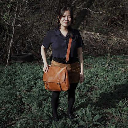 Soft saddle tan leather shoulder bag with a minimalist design
