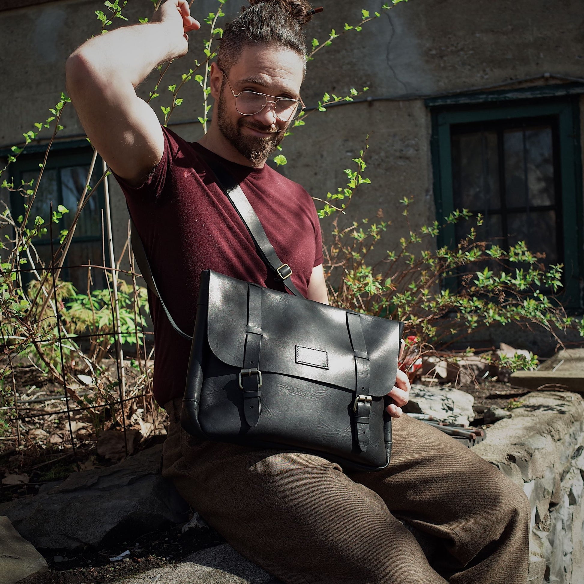 Soft black leather bag with a minimalist, professional design
