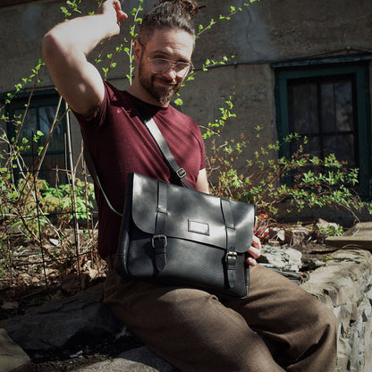 Soft black leather bag with a minimalist, professional design
