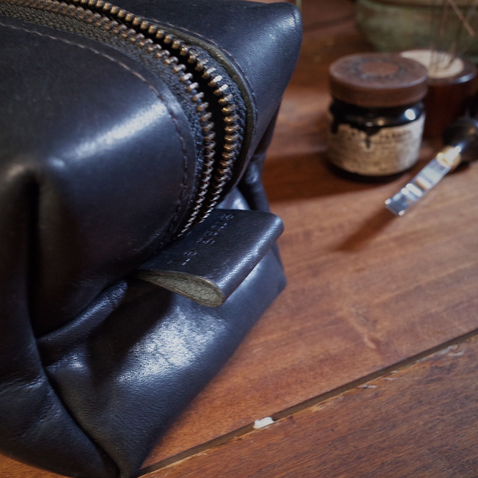 Artisanal black leather wash bag with sleek design, made in Canada
