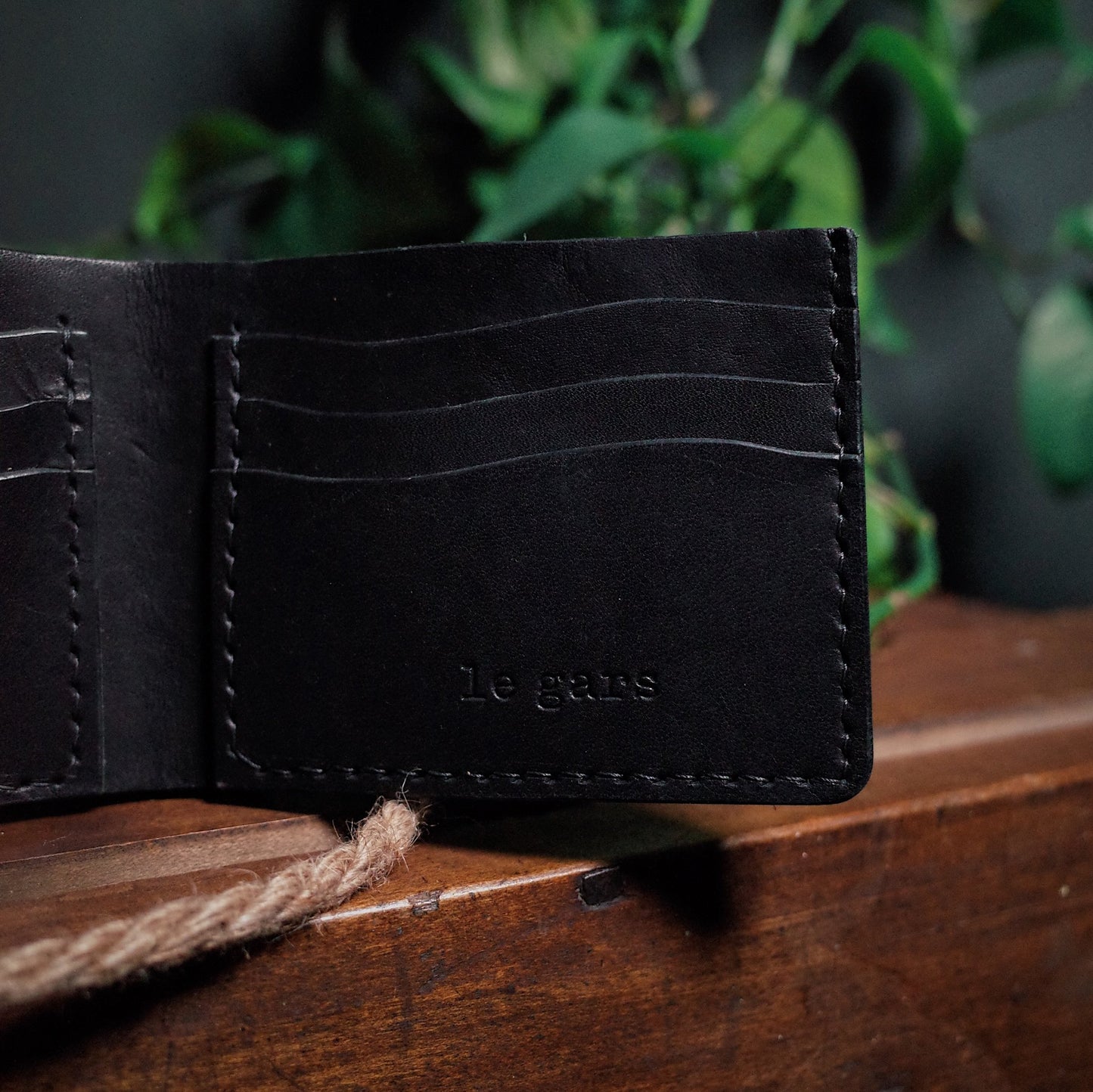 Premium black leather bifold wallet with elegant craftsmanship
