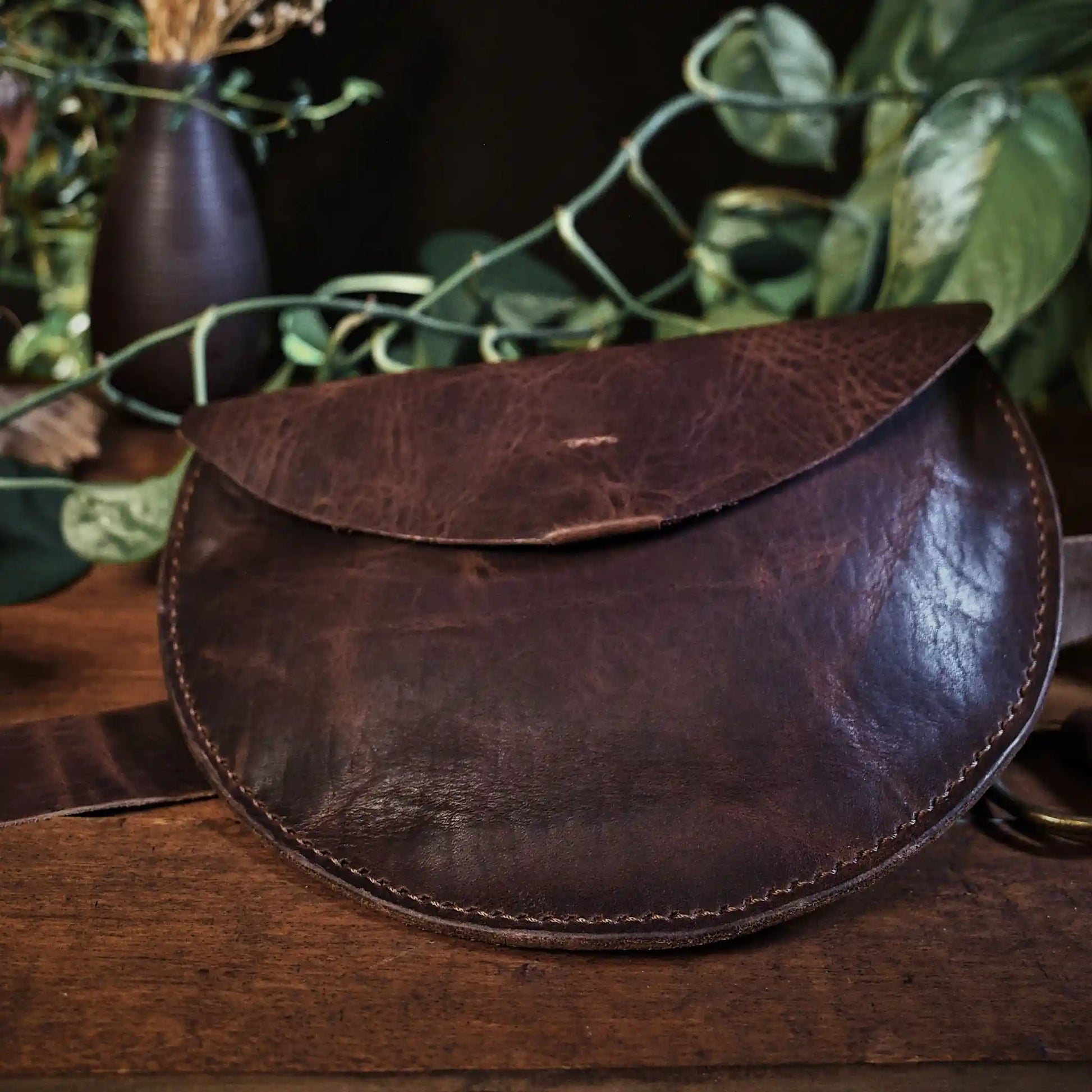 Minimalist caramel leather moon bag for parties and casual outings
