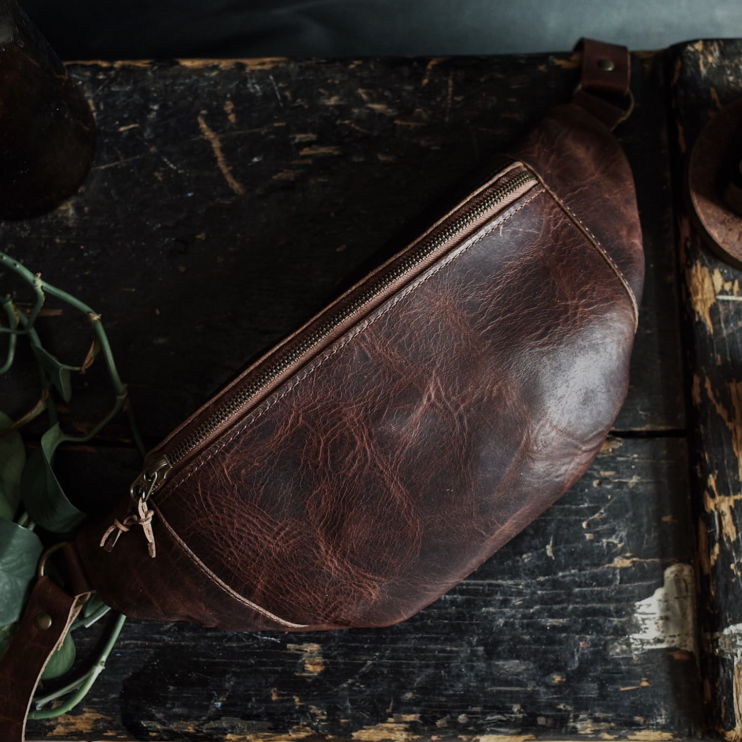Spacious mocha leather moon bag with premium stitching
