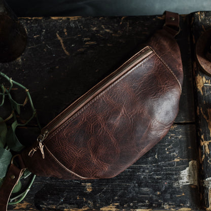 Spacious mocha leather moon bag with premium stitching
