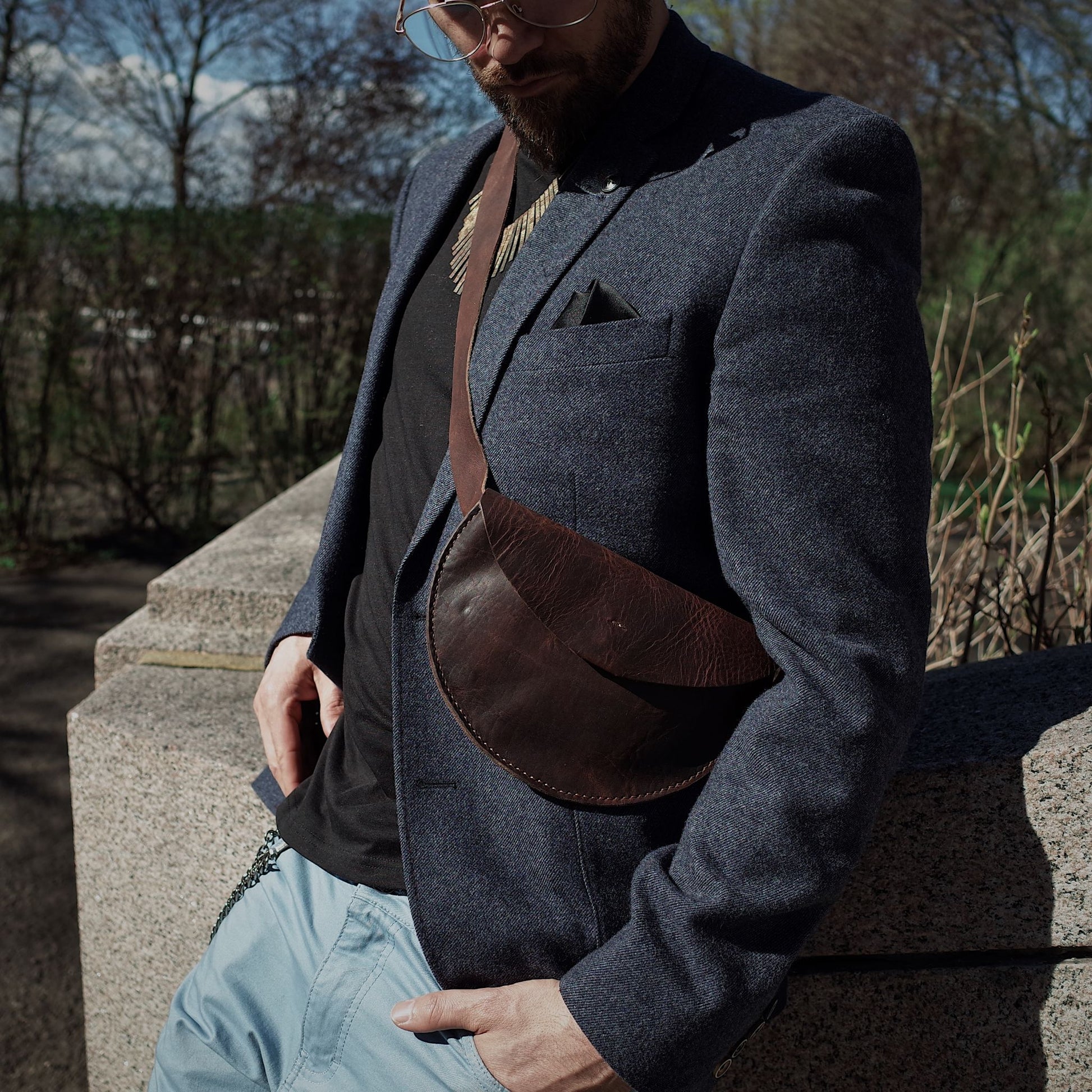 Stylish chestnut leather belt bag with a sleek design

