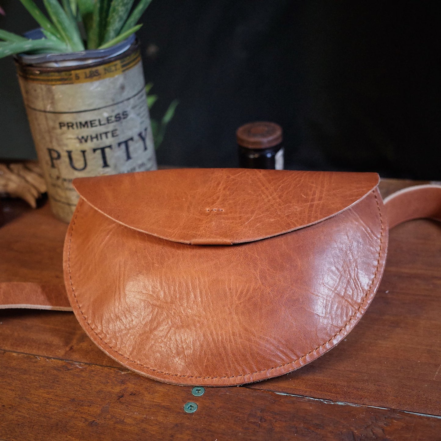 Elegant light brown leather fanny pack for hands-free carry
