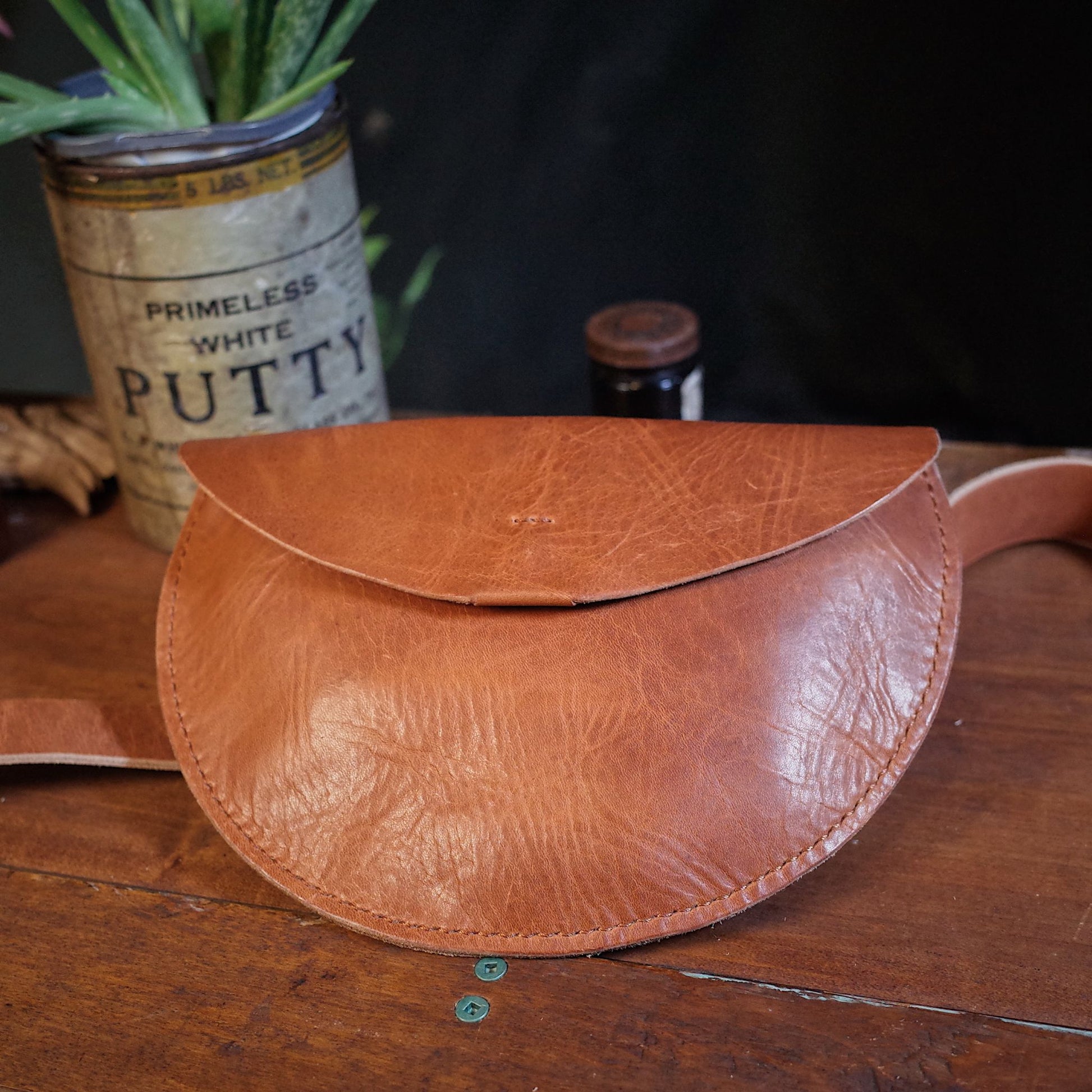 Elegant light brown leather fanny pack for hands-free carry
