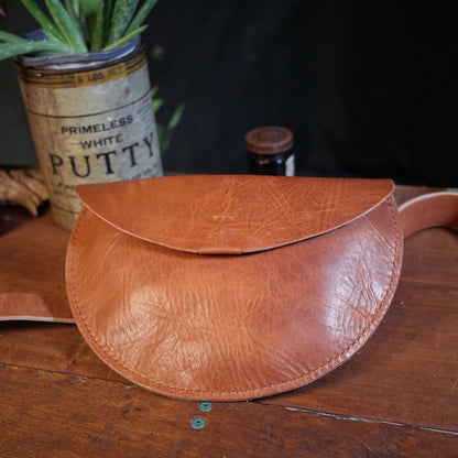 Elegant light brown leather fanny pack for hands-free carry

