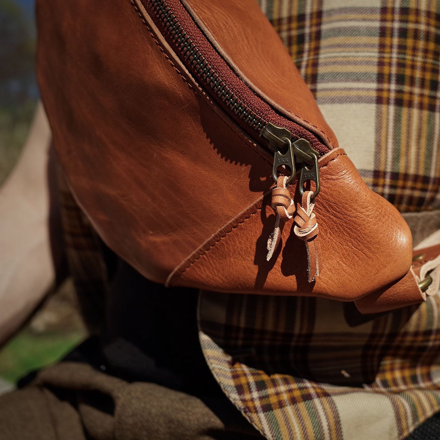 Large English tan leather moon bag perfect for travel essentials

