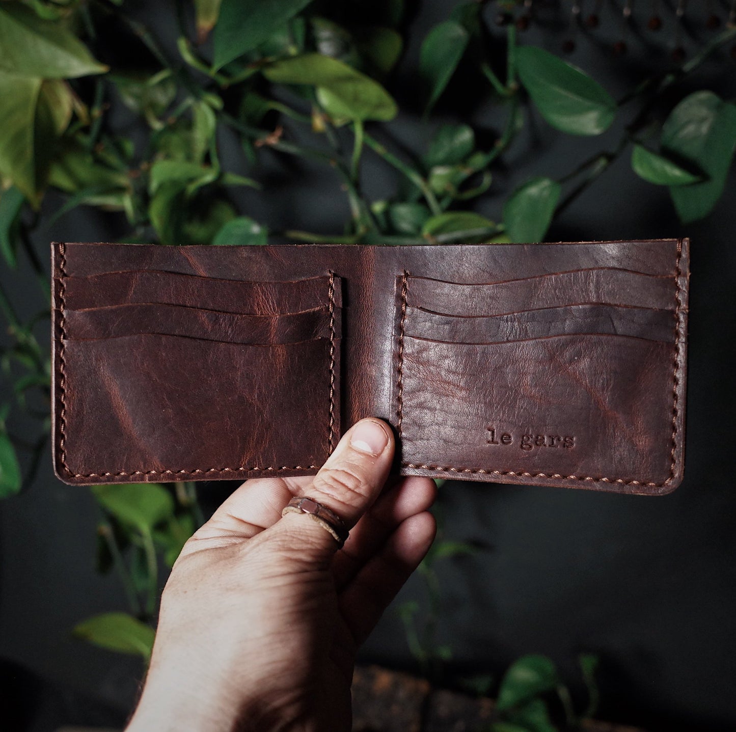 Minimalist chocolate leather bifold wallet with premium materials
