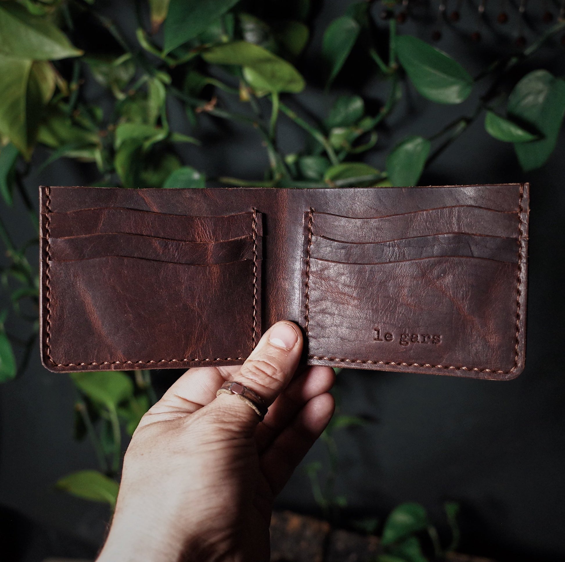 Minimalist chocolate leather bifold wallet with premium materials
