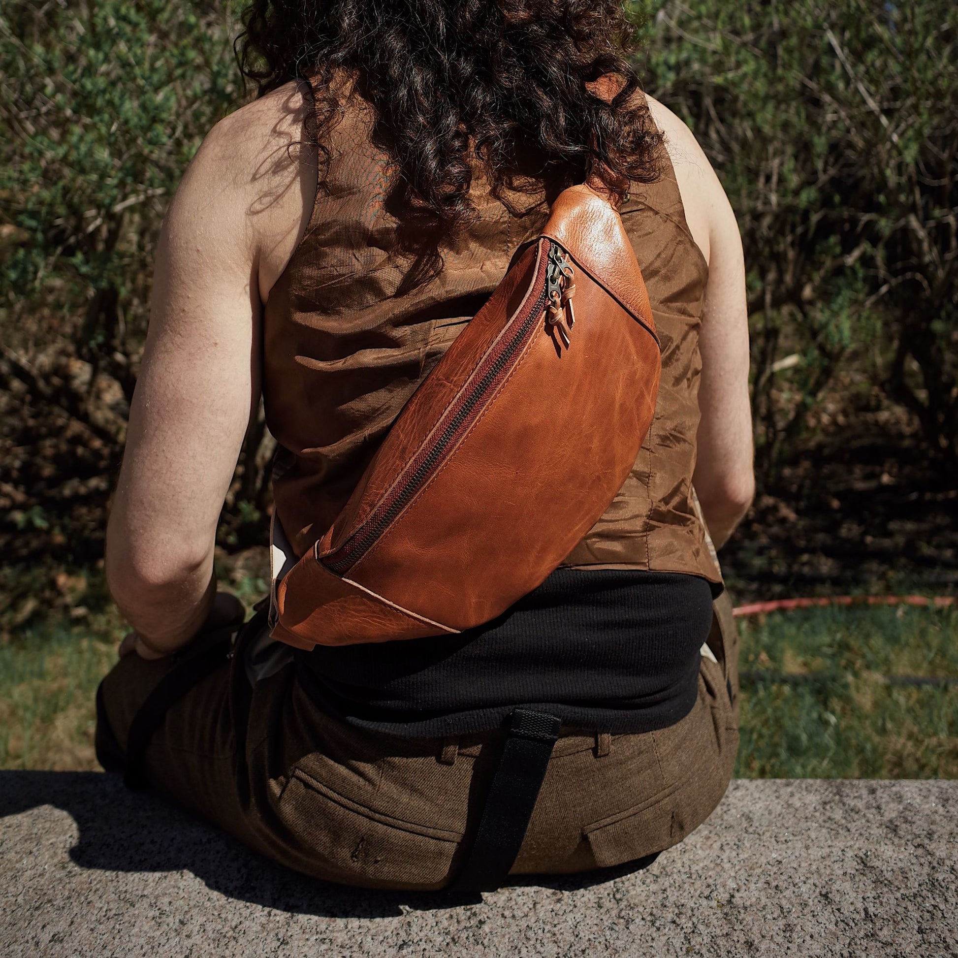 Roomy cognac leather fanny pack with secure zipper pockets
