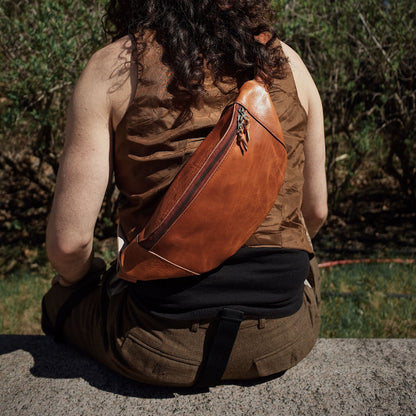 Roomy cognac leather fanny pack with secure zipper pockets

