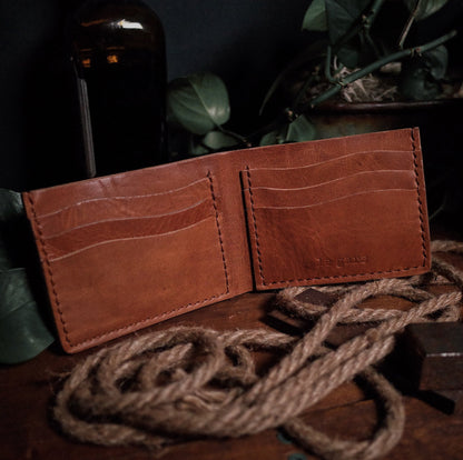 Compact caramel leather wallet with sleek, minimalist style
