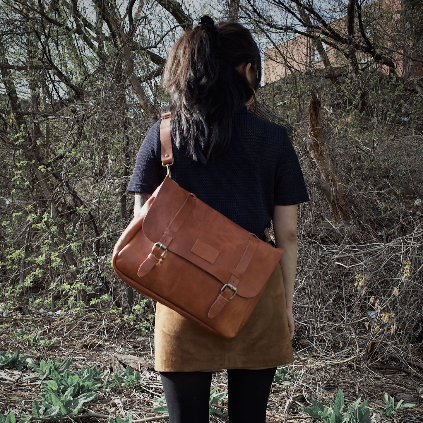 Premium honey brown leather bag with sleek, modern design
