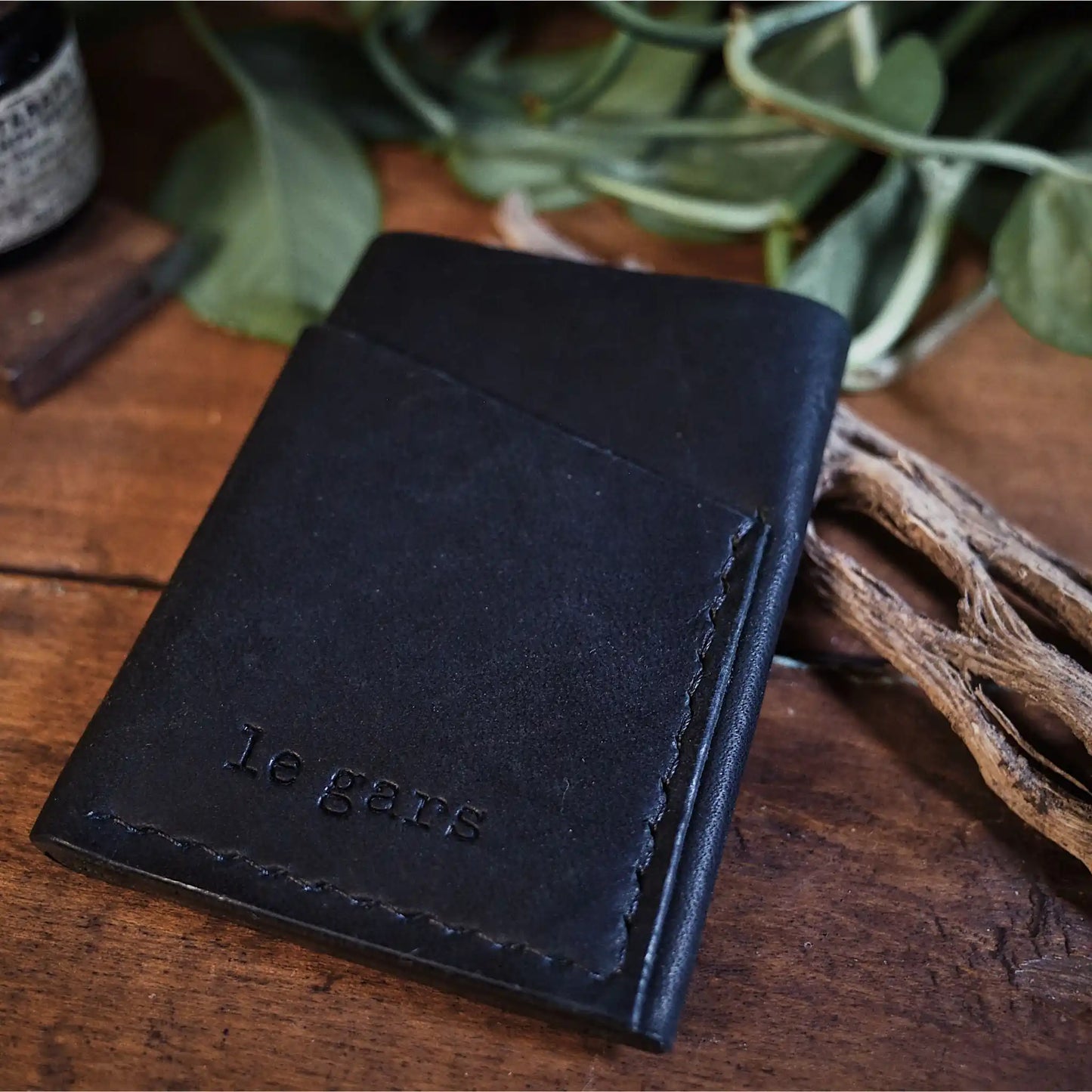 Minimalist full-grain black leather cardholder for men and women
