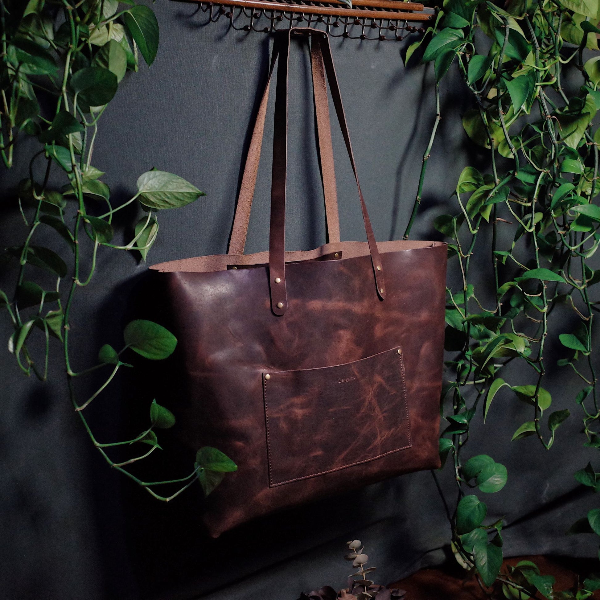 Full-grain dark-brown leather shoulder bag for work and travel
