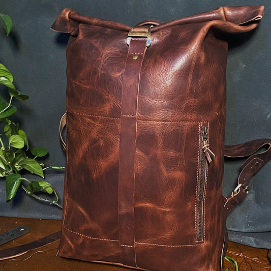 Minimalist chocolate leather roll-top knapsack with secure delivery buckle

