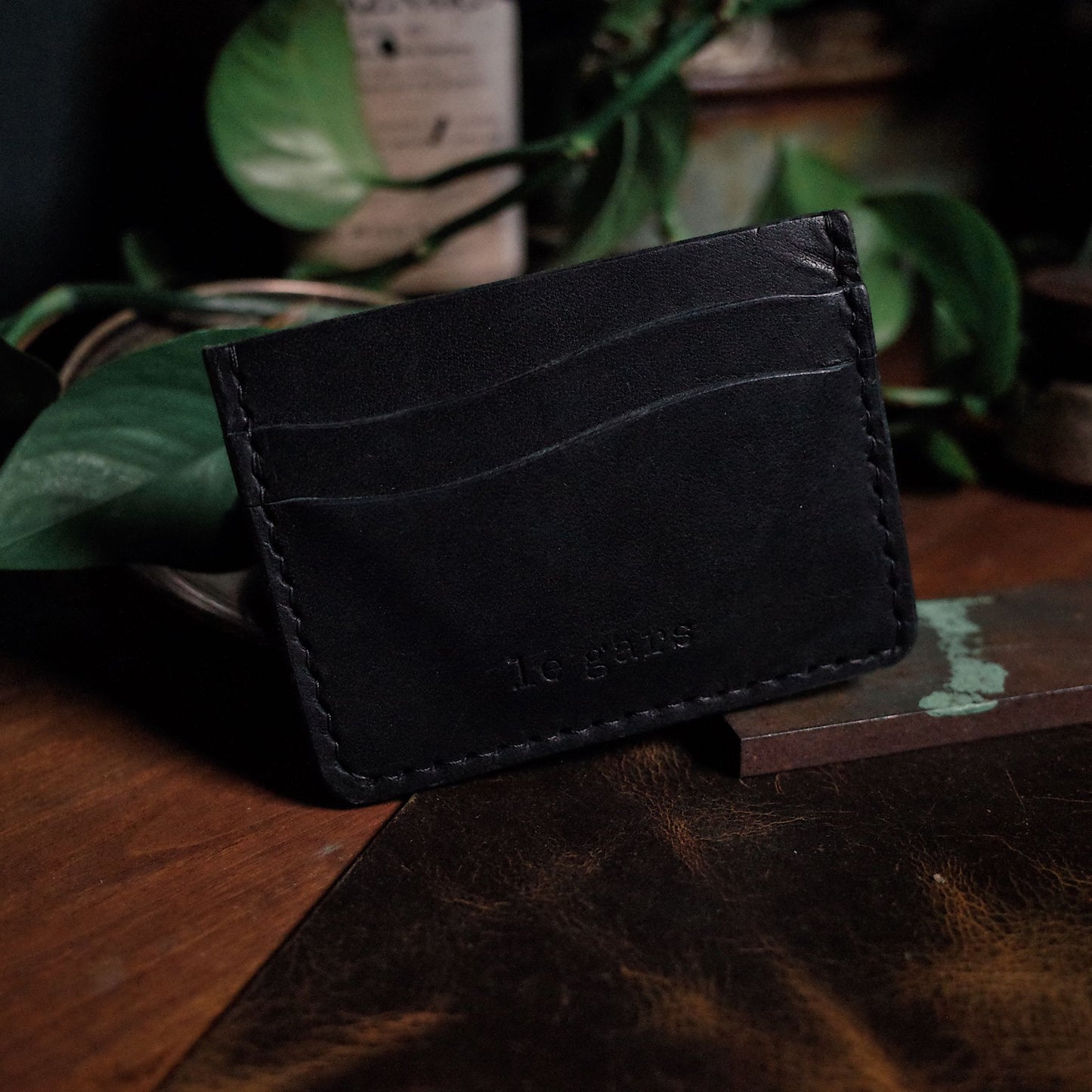 Stylish black leather wallet with a slim, minimalist profile