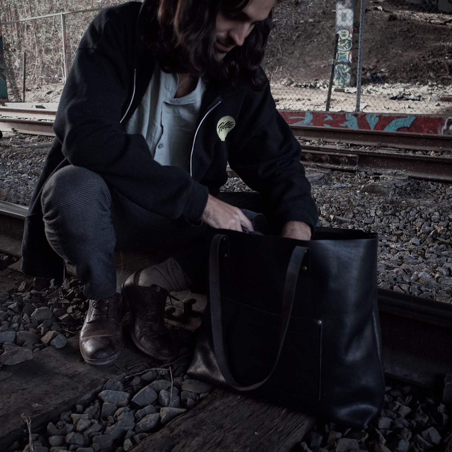 Artisanal black leather shoulder bag made from sustainable materials
