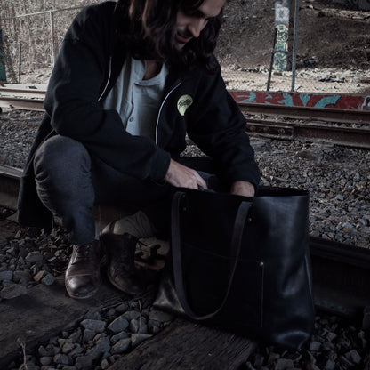 Artisanal black leather shoulder bag made from sustainable materials
