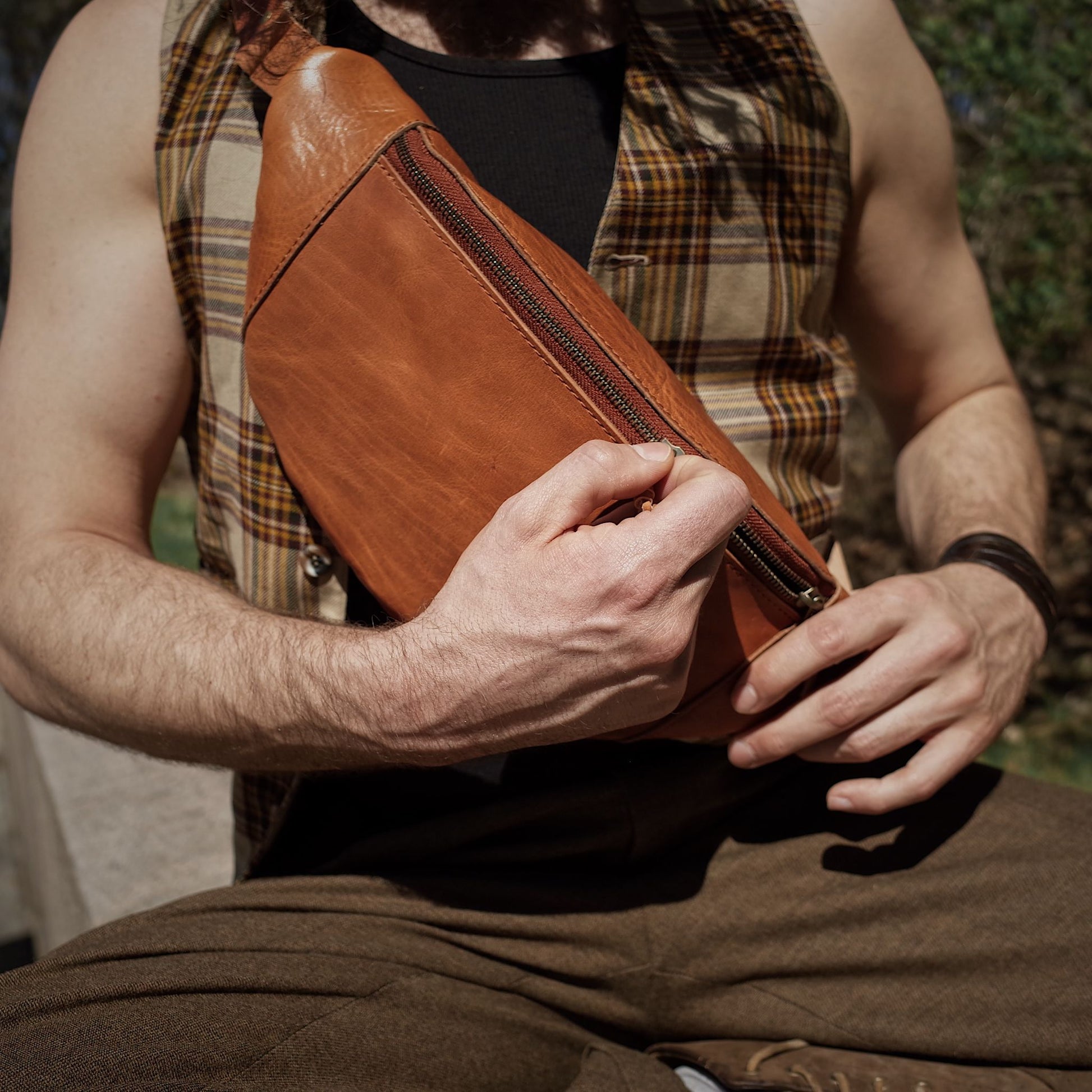 Full-grain saddle tan leather belt bag with oversized compartments

