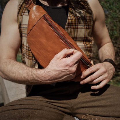 Full-grain saddle tan leather belt bag with oversized compartments
