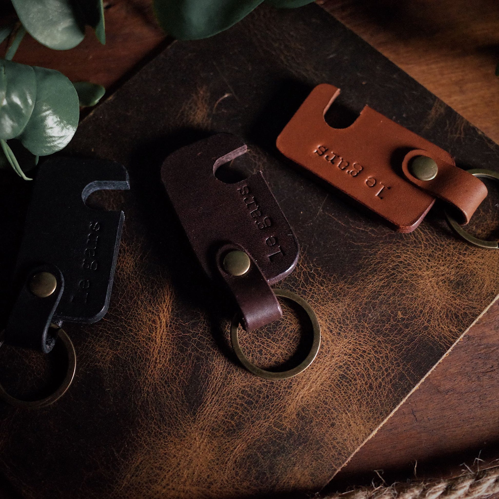 Durable light brown leather keychain with integrated phone holder
