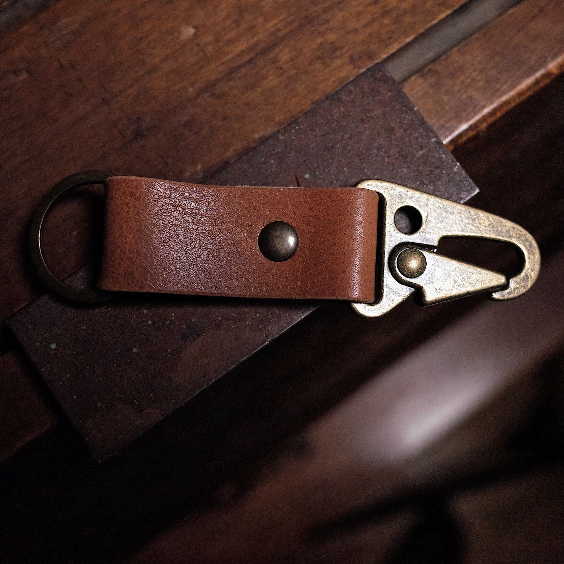 Full-grain caramel leather key fob with sleek, minimalist design

